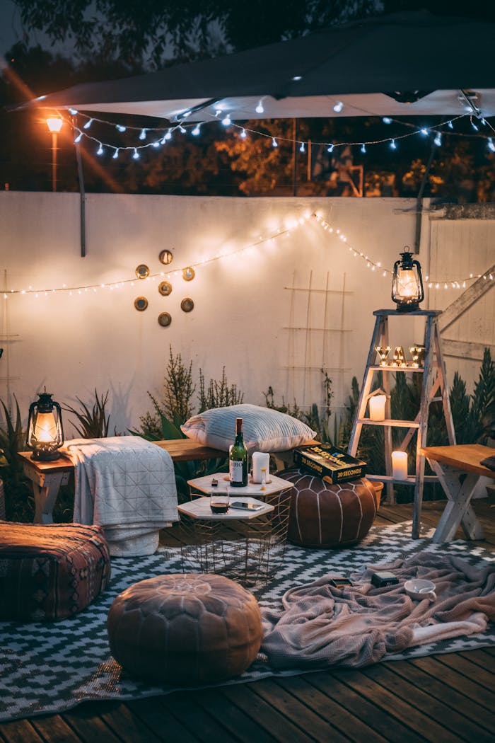 Charming outdoor patio setup with cozy lighting and luxurious decor for relaxation.
